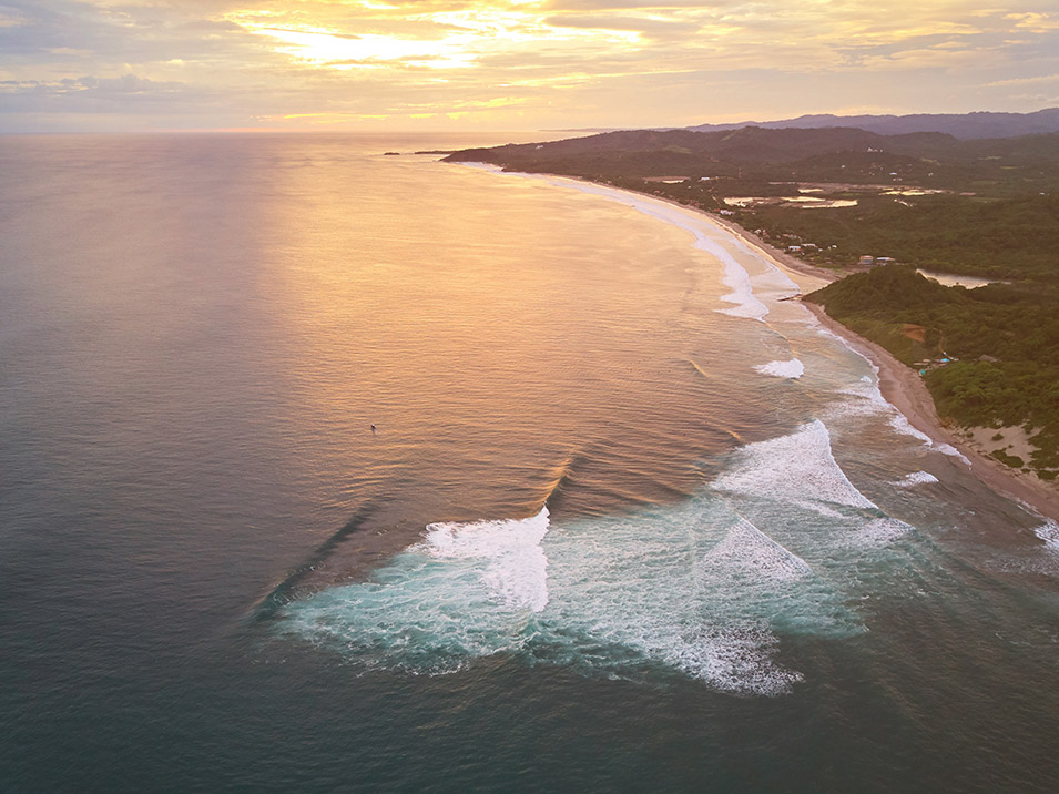 1251191 Famous bay for surf on Nicaragua Famous bay for surf on Nicaragua aerial drone view on sunset time